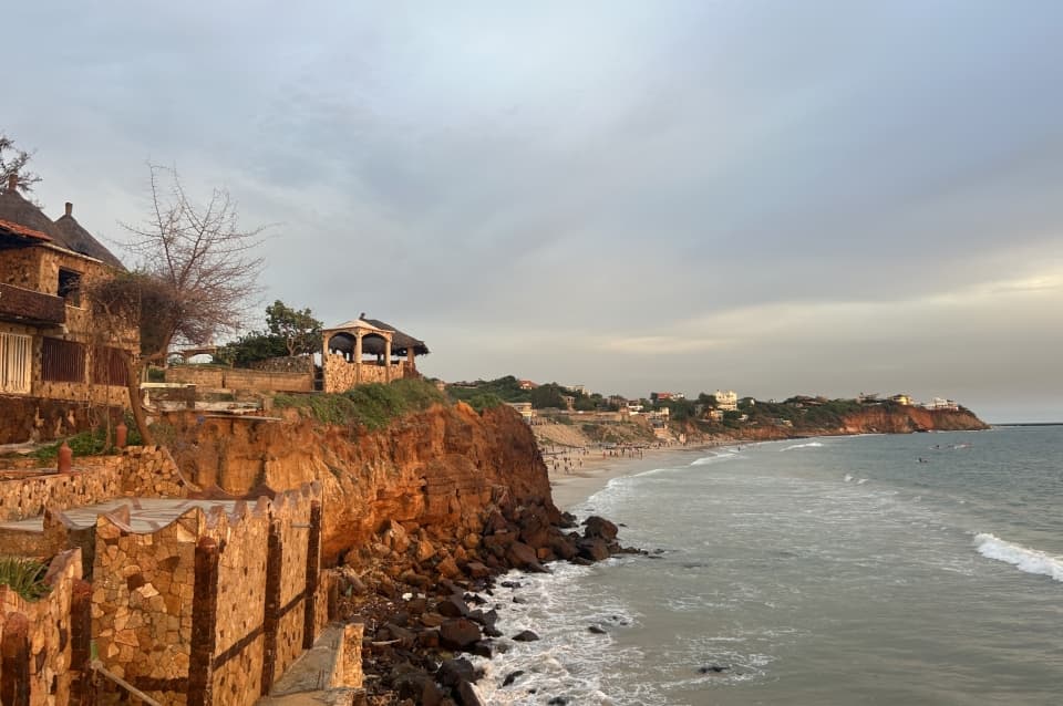 Coastal cityscape of Dakar Department, Senegal, wide aerial view showing the Atlantic shoreline and urban development