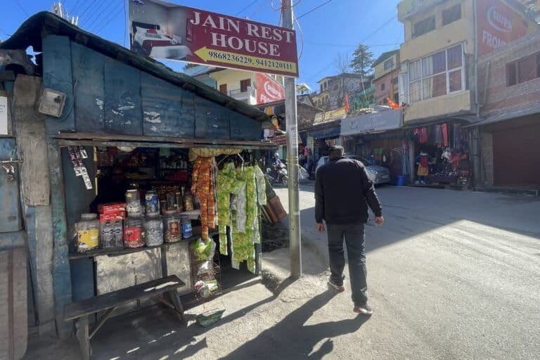 Street scene in Joshimath, India, capturing the local commercial environment and daily life in the town center.