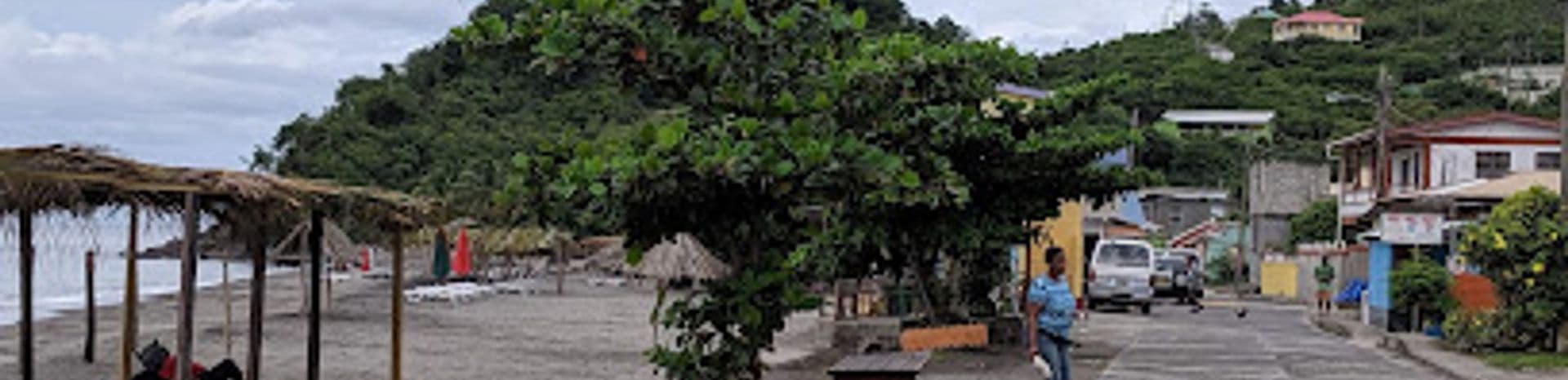 Outdoor dining areas at beachfront restaurants in Mahaut, Dominica