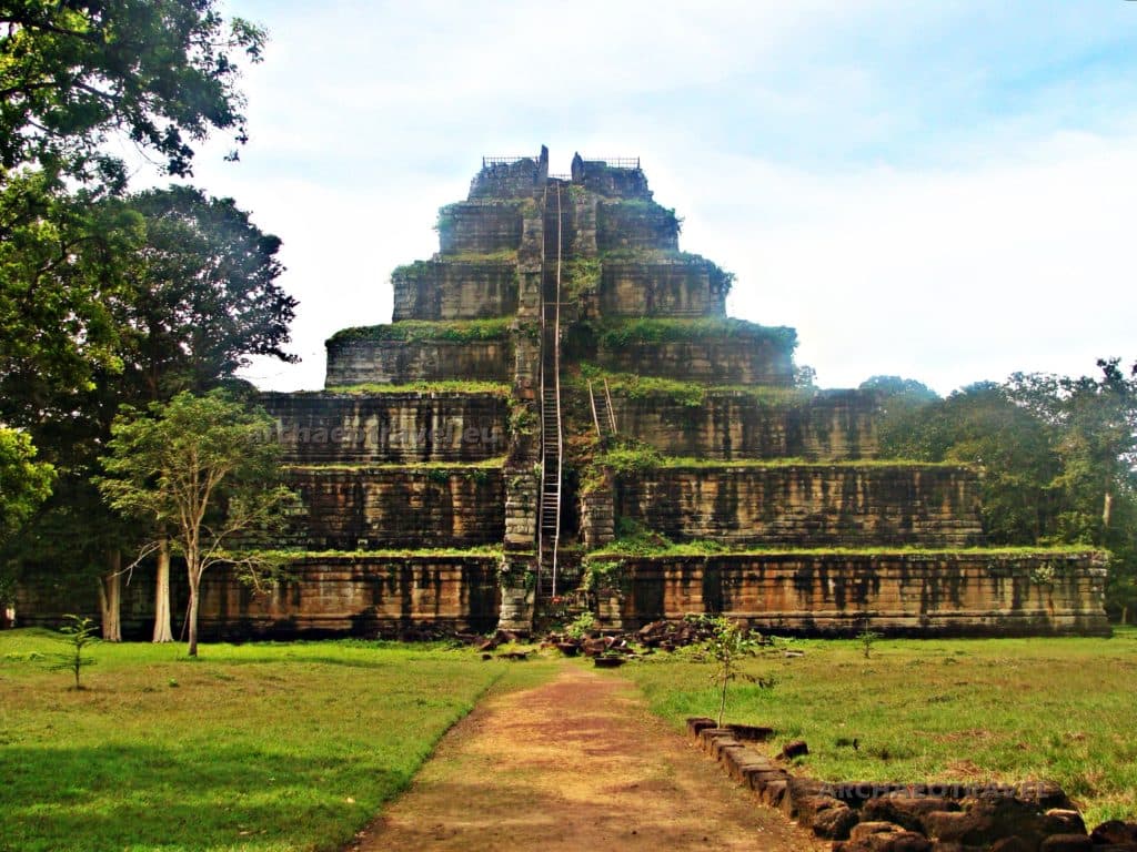 Aerial perspective of the Prasat Bakong temple complex in Cambodia, showing its large scale and rectangular moat.