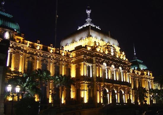 White neoclassical colonial building facade with columns in the historic center of San Miguel de Tucumán