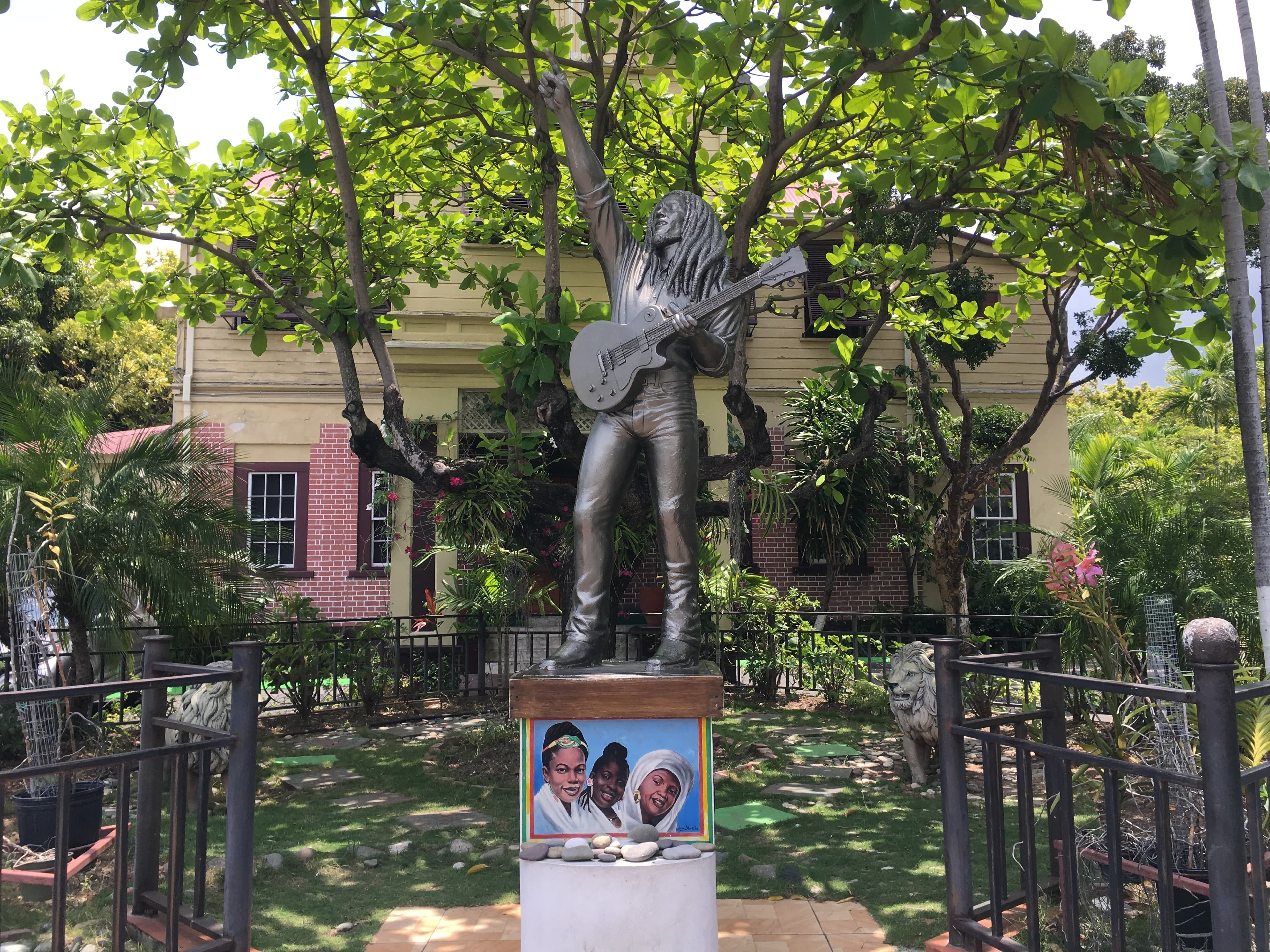 Bob Marley Museum in Kingston, Jamaica, showing the building facade and memorial statue