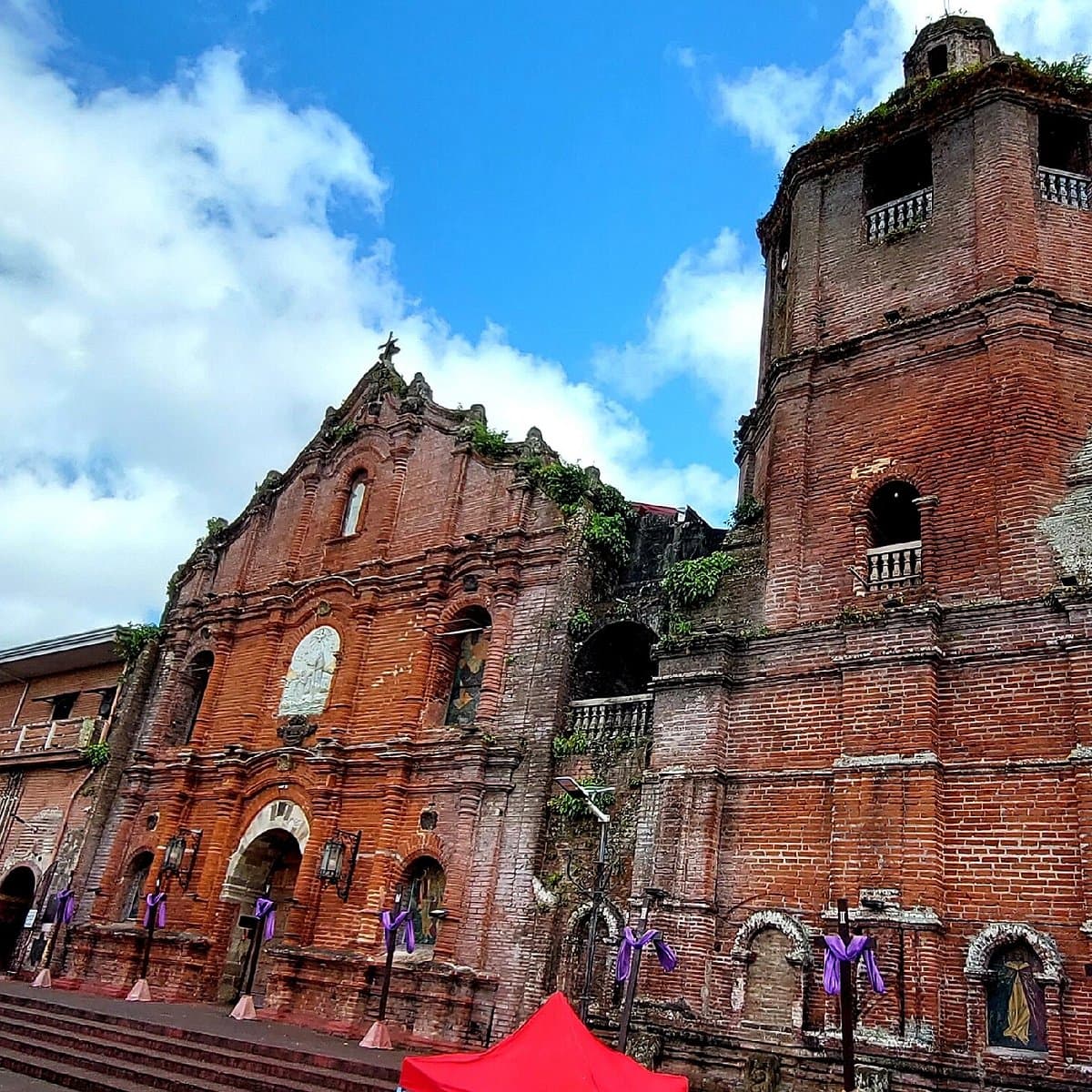 Exterior of historic church and ancestral houses in Sison, Philippines showcasing traditional architecture.