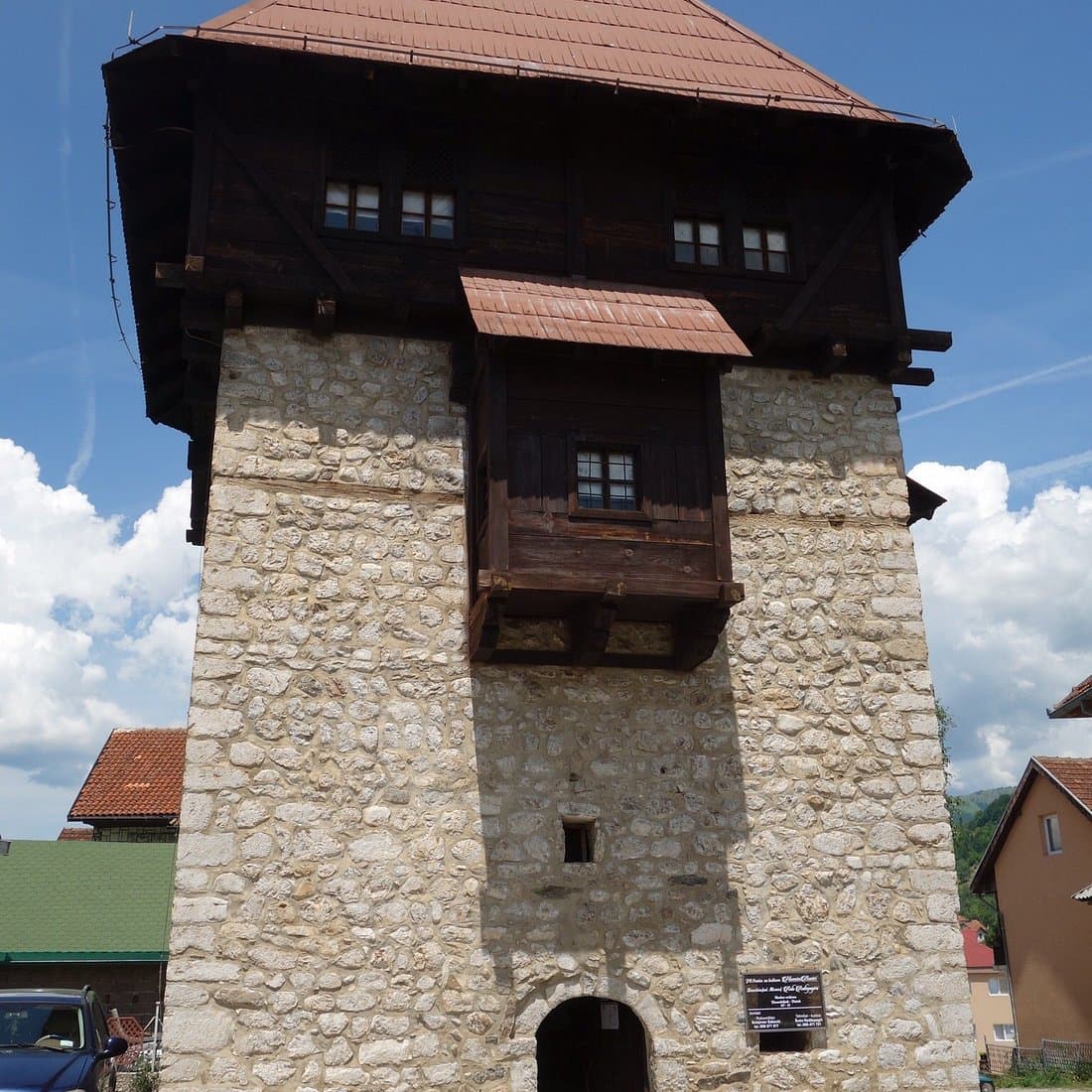 Ancient stone Kula tower in Plav, Montenegro, a historic landmark with weathered stonework and a conical roof