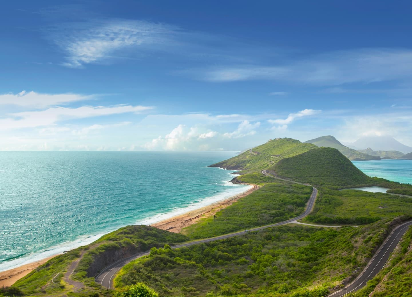 Green hills and coastline view in Saint Kitts suitable for road trips