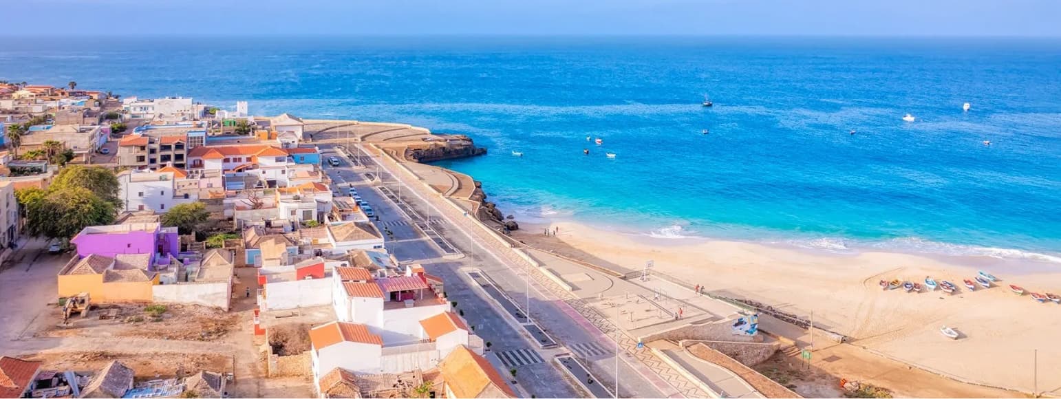 Scenic coastal view of Vila do Maio, Cape Verde, showing white sand beach and turquoise ocean