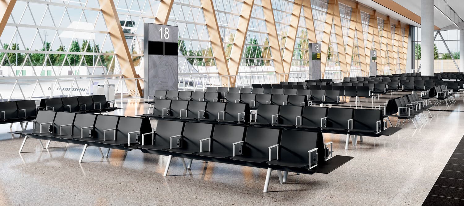 Row of empty modern seats in a quiet airport waiting area or lounge