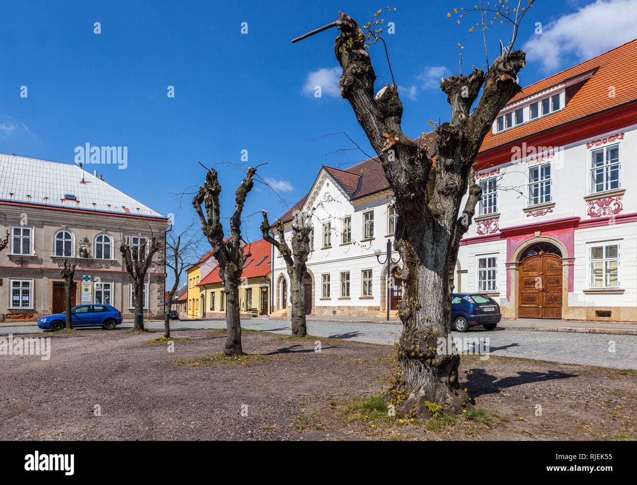 Town center of Železnice, Czech Republic, featuring classicist-style buildings on the main square in spring