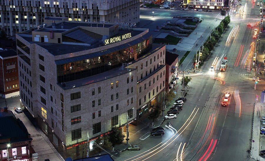 Aerial night view of the SK Royal Hotel building in Tula, the nearest major lodging hub for business travelers visiting Tonshalovo.