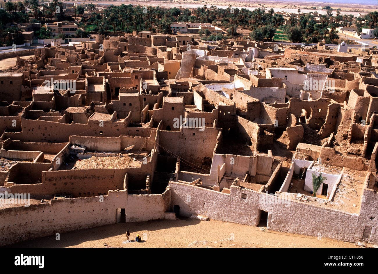Establishing shot of the old town of Ghat, Libya, showing traditional buildings and arid landscape