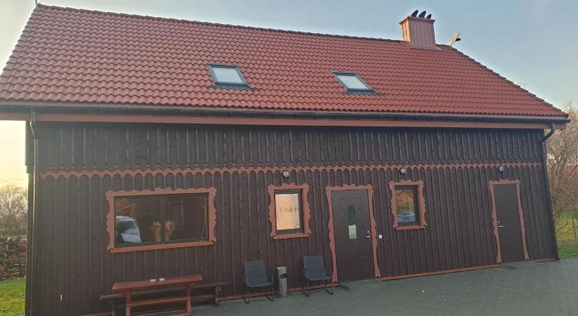 Traditional wooden house exterior in Rusnė village