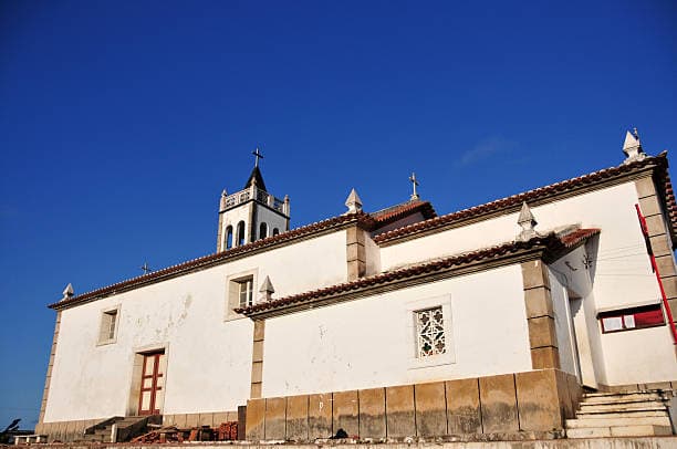 Front view of the Parish Church in Trindade, Sao Tome and Principe, showcasing its stone facade and bell tower