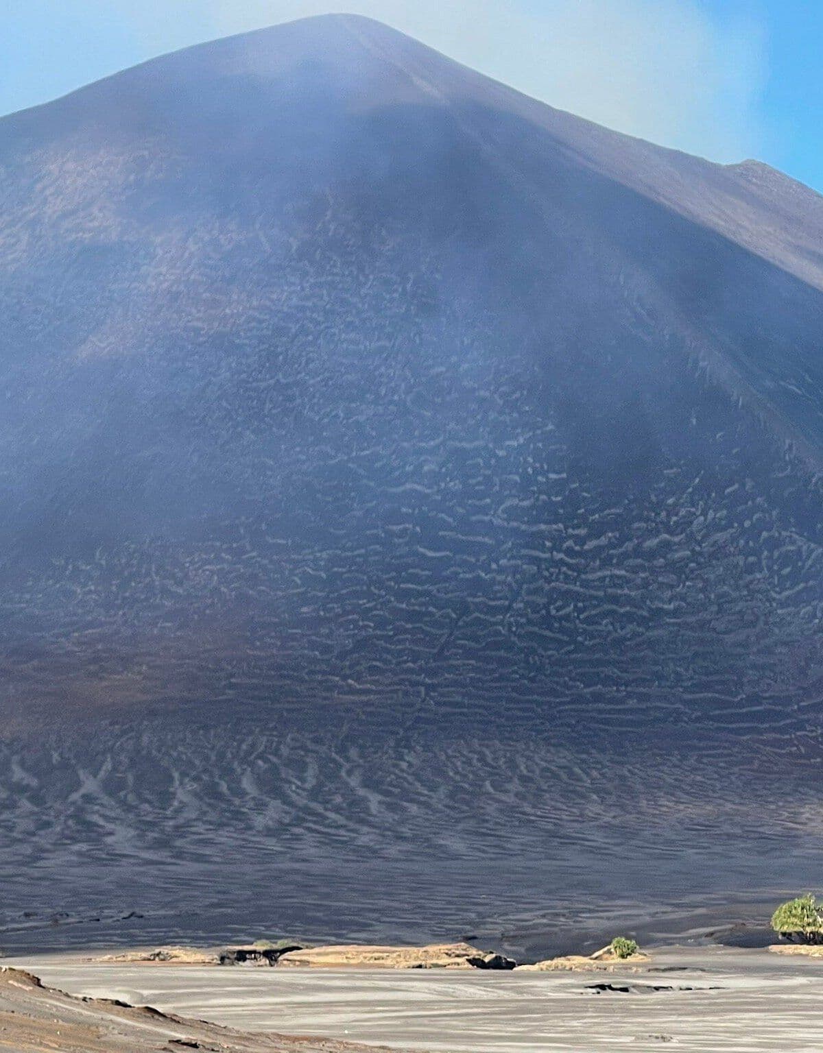 Wide view of Mount Yasur's barren volcanic cone and textured slope on Tanna Island, Isangel, Vanuatu