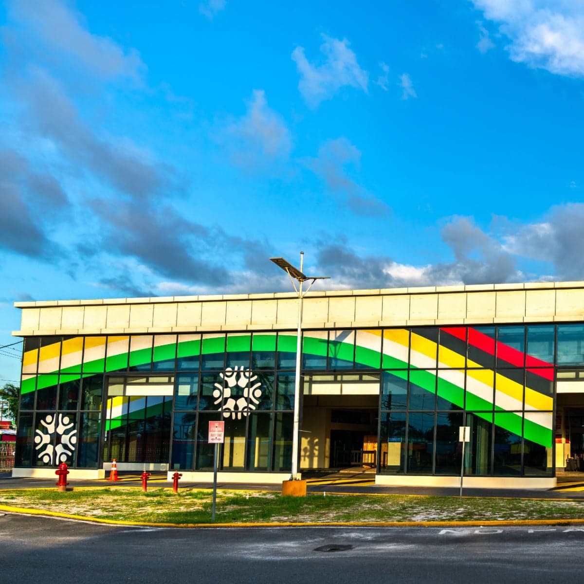 Front view of the airport terminal building in Georgetown, Guyana, with modern design elements