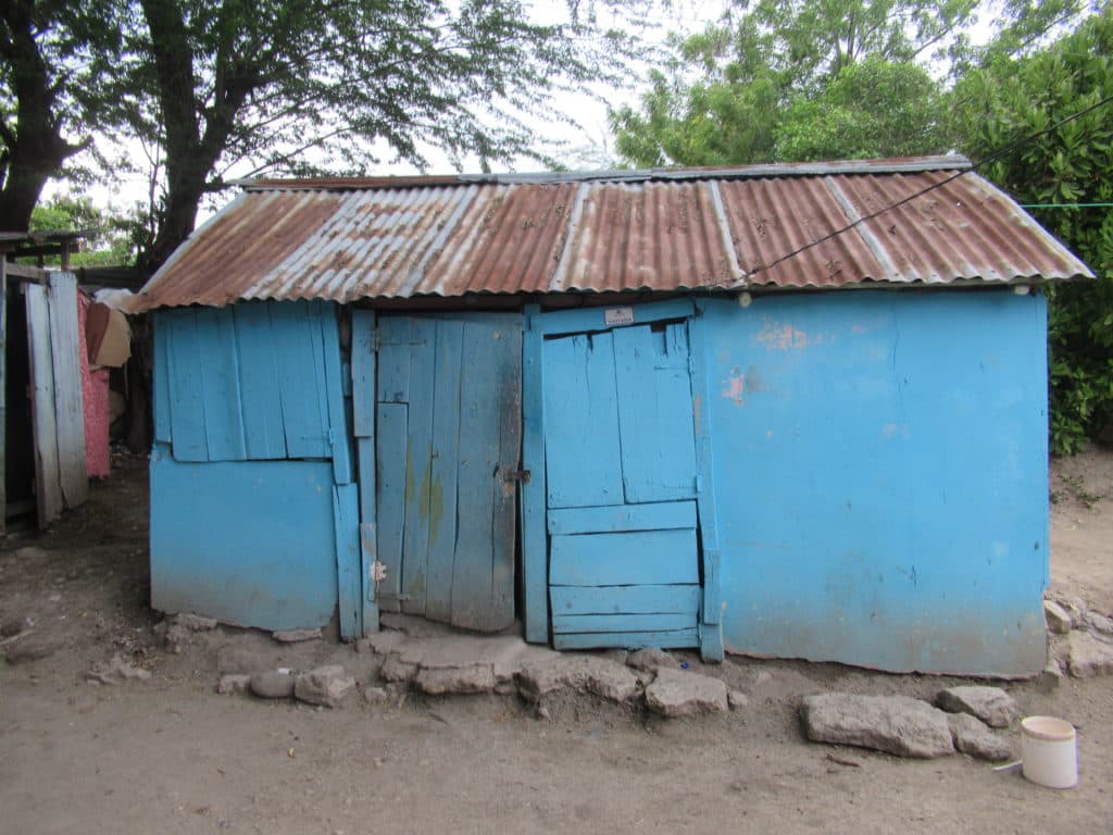 Exterior of a traditional home in Las Matas de Farfán, Dominican Republic, illustrating the rural setting for travelers
