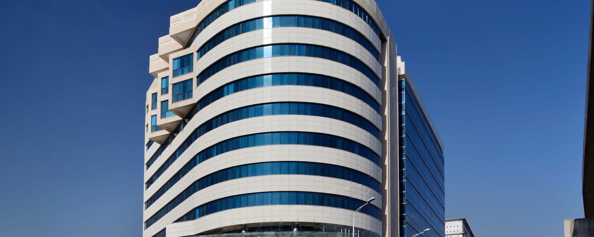 Modern building exterior with glass facade in an urban Ethiopian setting