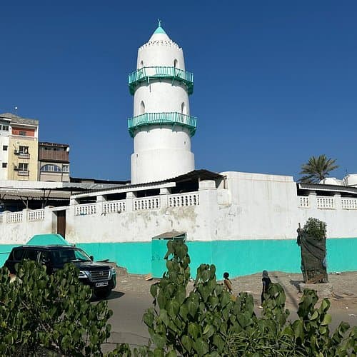 Exterior views of coastal accommodations near Djibouti City, featuring L’Oasis Guesthouse and Hotel Alia