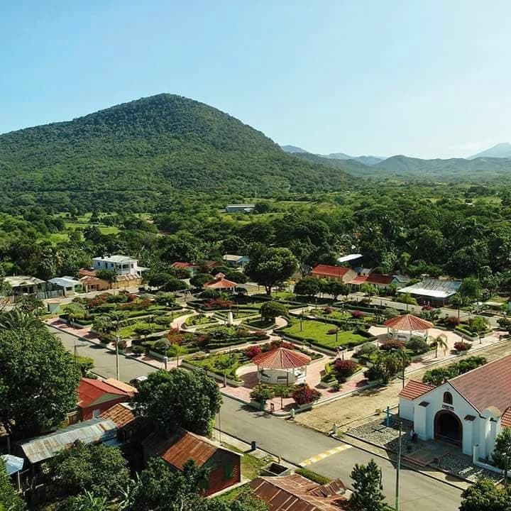 Rural market scene with local buildings and vegetation in the Las Matas de Farfán area, Dominican Republic
