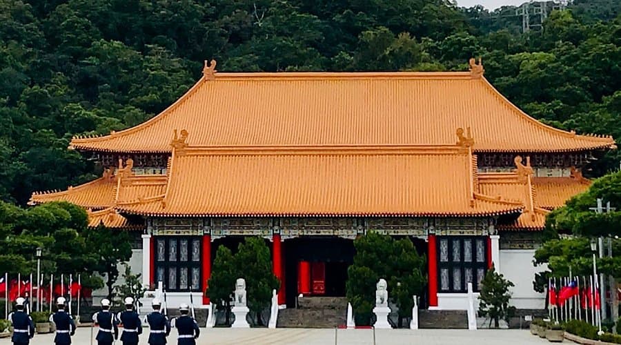 Exterior of the Keelung Martyrs Shrine, a white traditional-style building on a hill overlooking the sea
