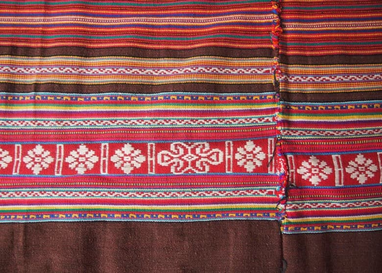 Close-up of colorful geometric patterns on traditional tais cloth from East Timor
