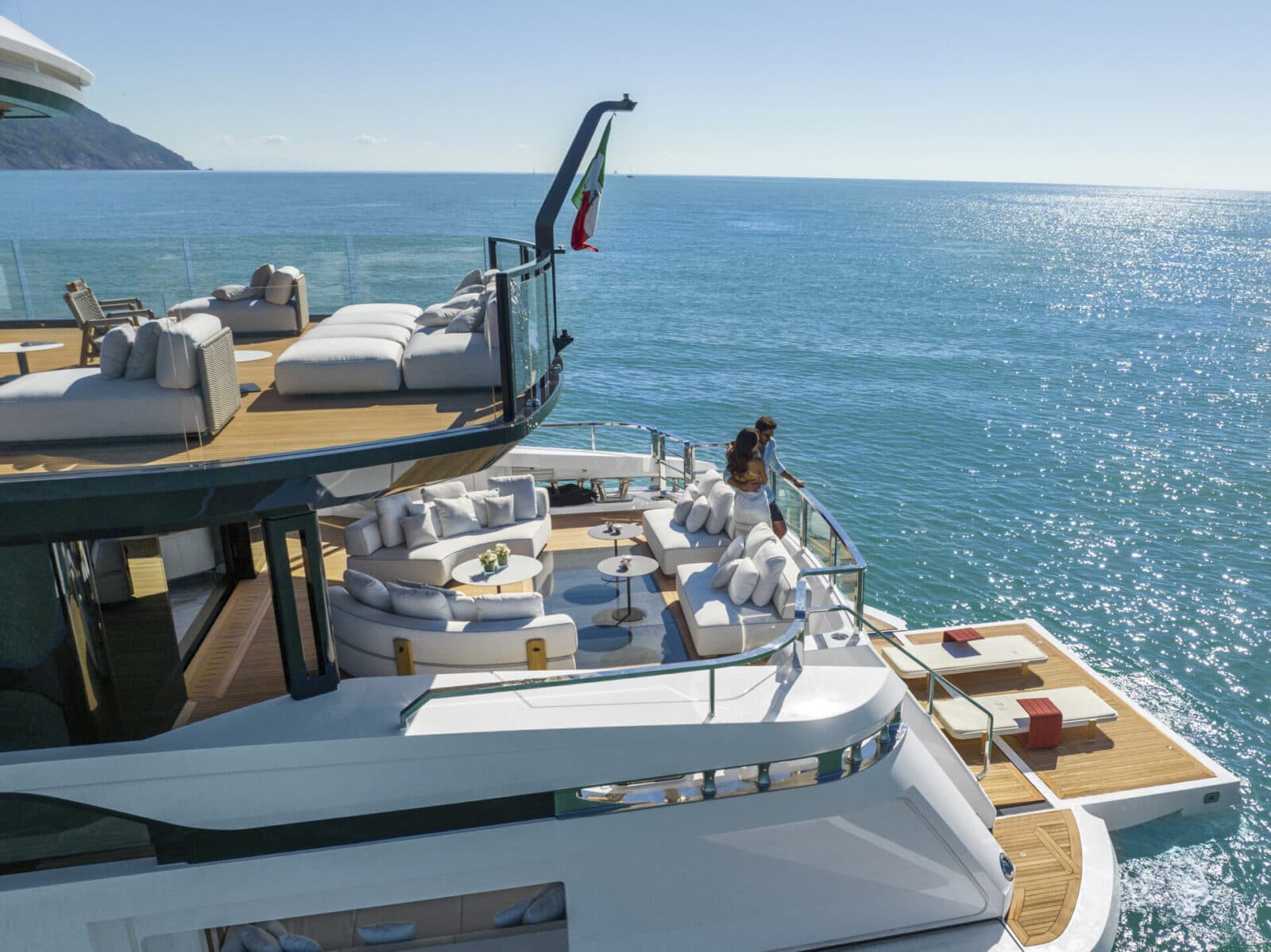 Side profile of a modern luxury yacht sailing on calm blue waters